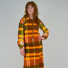 "Stunning 1970's plaid maxi dress! Made in a bold Autumn toned plaid pattern. Made in a super soft cotton material. The cotton has a pretty sheen to it, much like a polished cotton. Pointed collar, button down bodice / collar. Balloon sleeves with buttons at cuffs. Unlined. ♥♥ Fits Like: XS - Small TAG: -- BRAND: -- Excellent Vintage Condition: ♥ MEASUREMENTS; Bust: 33\" Waist: 31\" Hips: 40\" Length: 54.5\" Shoulder seam to seam: 14\" Underarm seam: 18.5\" Measurements of Model: Bust: 35\" Wais Plaid Pattern, Dresses Xs, Cotton Material, 1970s, Bodice, Plaid, Long Sleeve Dress, Maxi Dress, Womens Dresses