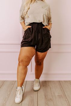 - Keep it casual in these trendy shorts! - Lightweight unlined material - A high elastic waistline with a faux drawstring accent tie - A faux zip fly accent - Functional side pockets as well functional low cargo style pockets - A relaxed silhouette that ends in straight mid-thigh length hemlines Black Curves, High Waist Shorts, Cargo Style, Trendy Shorts, 2025 Fashion, Women Clothing Boutique, High Waisted Shorts, Online Womens Clothing, Boutique Clothing