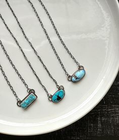 "Sterling silver necklaces, featuring beautiful turquoise stones, cut and polished by the Otteson family!  (You can see them on the show Turquoise Fever!) All of these feature 18\" chains, that have been soldered to the backplate of the design (this means the clasp will always stay at the back of your neck where it belongs!) The chains and all metal on these are 925 Sterling Silver.   The chains have been oxidized to highlight these gorgeous stones. Entirely crafted from solid 925 Sterling silver  Slowly forged by hand, these are one of a kind pieces of jewelry Please make your selection from the second photo, only one of each available.  Ready to ship, with fast and free shipping Handmade with lots of love in my mountain studio in California" Silver And Turquoise Jewelry, Turquoise Bar Necklace, Silversmith Jewelry, Charm Ideas, Silversmithing Jewelry, Nashville Outfit, Silver Smithing, Turquoise Bar, Silversmith Jewellery