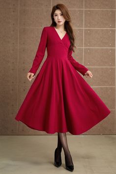 This red wool dress is very elegant. You will be the center of everyone's attention when you wear it! Crafted from smooth wool fabric, this red dress has a delightful V-neckline and long sleeves. You won't want to take it off when you put it on, and it's perfect to wear on some important festivals like Christmas! DETAIL * 30% wool, 30% fiber, 40% polyester * fully satiny lining, more nice to the touch body * V neck dress * Two side seam pockets * Right zipper closure * Long sleeves dress * Fit and flare dress * Mid-calf length dress * Swing wool dress * Perfect for autumn, winter * This belt is not for sale * Lean More about the items From the FAQs on the page bottom MODEL SIZE Bust 85 cm(33.4") Waist 67 cm(26.7") Height 168cm (5' 6") She wears size XS Choose CUSTOM Order if you * Need a b V-neck Solid Color Midi Dress For Winter, Winter V-neck Solid Color Midi Dress, Elegant A-line V-neck Dress, Chic Knee-length V-neck Winter Dress, Fitted Wool V-neck Dress, Formal Wool A-line Dress, Formal Wool Dress For Winter, Elegant Fit And Flare Winter Dress, Elegant Winter Fit And Flare Dress