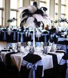 the tables are decorated with black and white linens