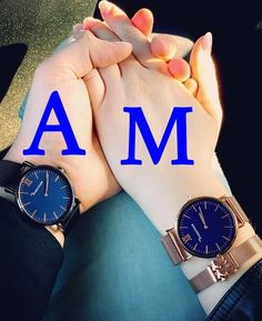 two hands holding each other with the letter m on their wrist and an i am sign above them