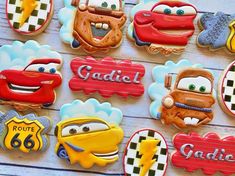 decorated cookies are displayed on a table for children's birthdays and special occasiones