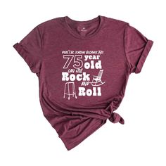 a women's t - shirt with the words 75 year old rock and roll on it