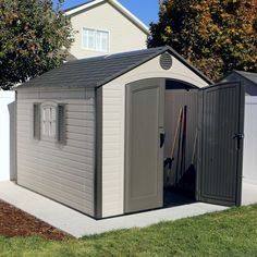 an outdoor storage shed with the doors open