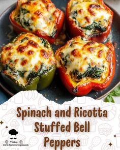 spinach and ricotta stuffed bell peppers on a plate with text overlay that reads spinach and ricotta stuffed bell peppers