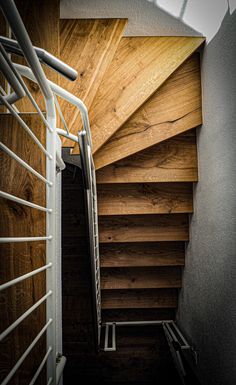 the stairs are made of wood and metal