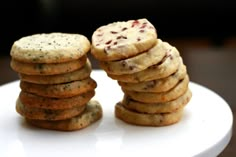 a stack of cookies sitting on top of a white plate