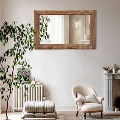 a living room filled with furniture and a mirror