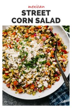 mexican street corn salad with feta cheese and cilantro in a white bowl