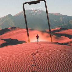 a person standing in the middle of a desert with an iphone on their back,