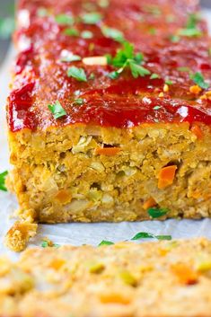 a meatloaf with carrots and ketchup on top