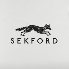 a black and white photo of a logo for sekfoord with a fox on it