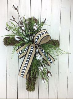 the wreath is decorated with cotton and grass