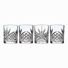 three glasses with pineapple designs on them