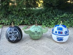 three star wars pumpkins painted to look like characters