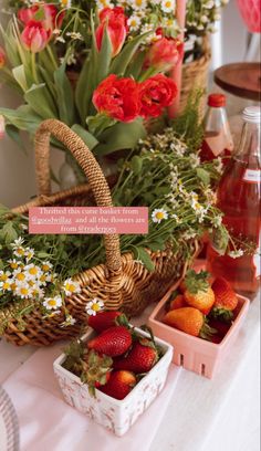 a table topped with baskets filled with fruit and flowers