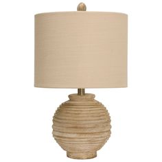 a table lamp with a beige shade on it