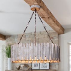 This 3-light chandelier brightens up your family room and adds a country-inspired design to your space. It's made from metal and wood for an antique country cottage aesthetic. The open-work drum shade all around the edge that encases the candelabra. The 40W candle bulbs (not included) wash your dinner or prep space in a warm glow. Parrot Uncle 3-Light White Farmhouse WoodChandelier | BB8813-3110V Wood And Metal Chandelier, Statement Chandeliers, Wooden Chandelier, Rustic Candles, Transitional Pendant Lighting, Wood Chandelier, Metal Chandelier, Drum Chandelier, Chandelier Pendant Lights