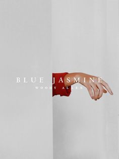 a person's hand reaching for something with the word blue jasmine on it