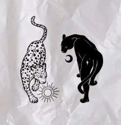 two black and white leopards on crumpled paper