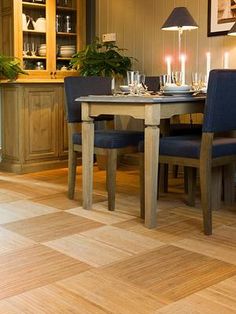 a dining room table with blue chairs around it