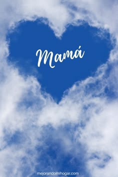 the word mamma written in white on a blue heart - shaped cloud filled sky