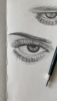 a pencil drawing of two different eyes