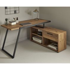 a wooden desk with metal legs and a book shelf underneath it, next to a white wall