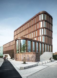 a large building with many windows on the side of it and stairs leading up to it