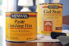 two cans of minwax gel stain sitting on top of a table next to each other