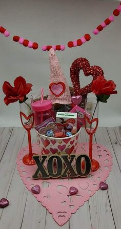 a valentine's day gift basket is displayed on a table