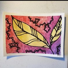 a piece of paper with a drawing of a leaf on it