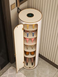 an open cabinet with several pairs of shoes in it