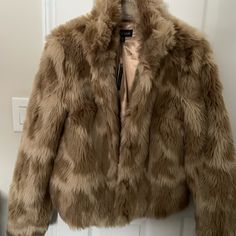 Tan Faux Fur Multi Shade Lined Jacket. Brand New With Tags. Hook And Eye Closure. Trendy Beige Faux Fur Outerwear, Brown Faux Fur Outerwear For Spring, Spring Brown Faux Fur Outerwear, Trendy Brown Faux Fur Outerwear, Dark Green Coat, Grey Pea Coat, Faux Leather Coat, Camouflage Jacket, Black Faux Leather Jacket