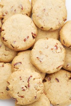 a pile of cookies sitting on top of a white plate