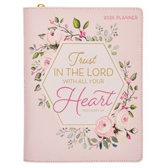 a pink bible cover with flowers and the words trust in the lord with all your heart