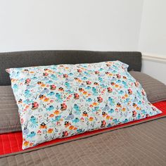 a bed with a pillow on top of it