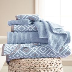 towels stacked on top of each other in a basket