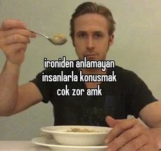 a man is eating cereal from a white bowl