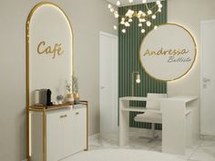 a white and gold dining room with an oval mirror on the wall above it that says cafe