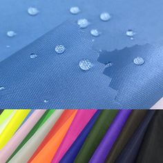 several different colors of fabric with water drops on the top and bottom, including blue