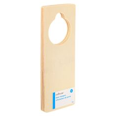 a wooden door hanger with a hole in the middle