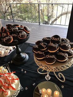 a table topped with lots of cakes and desserts