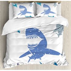 a bed with blue and white shark print on it