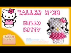 a hello kitty pinata with an envelope in the back ground and a hello kitty balloon attached to it