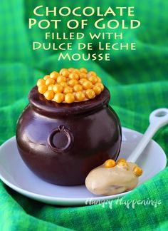 chocolate pot of gold filled with dulce de leche mousse on a plate