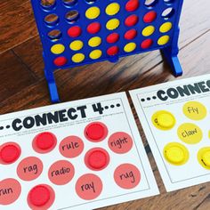 two connect 4 connect game boards sitting on top of a wooden floor next to each other