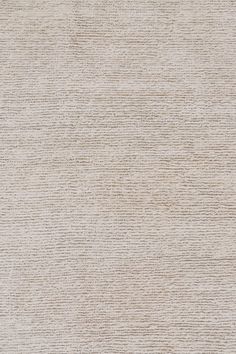 an area rug with white and beige colors