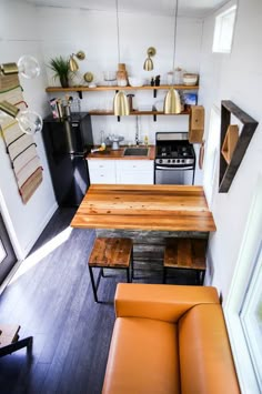 the kitchen is clean and ready to be used as a living room or dining area